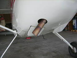 This photo shows exhaust piping opening and cowl flaps. This is installed on a 1957 Cessna 180.
